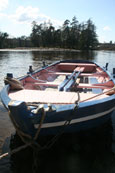 A salmon fishing boat moored on the banks of the River Tay at Campsie Linn, Campsie neat to the Guildtown, Perthshire, Scotland