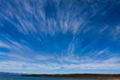 Autumn afternoon sky over the islands of Rona and Skye from Redpoint in Wester Ross, Scotland