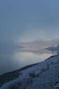 A Highland Winter Mist settling over Loch A Chroisg near Achnasheen in Wester Ross with the Torridon Mountain Range Looming in the background, Wester Ross, Scotland