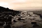 Redpoint Burn flowing out to sea over Redpoint beach near Badacahro, Wester Ross, Scotland