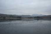 Loch Nan Dailthean frozen in winter near Aultbea, Wester Ross, Scotland