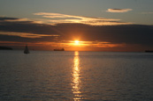 The sun setting on English Bay, Vancouver, British Columbia, Canada