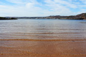 Loch Gairloch gently lapping on the Golf Course Beach, Gairloch, Wester Ross, Scotland