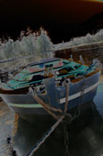 A fishing boat in the pool at Campsie Linn on the River Tay at Campsie near to The Guildtown, Perthshire, Scotland