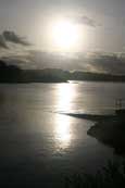 The November afternoon sun setting over the bay at Charlestown on Loch Gairloch, Gairloch, Wester Ross, Scotland