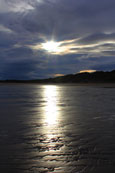 The autumn sun setting over Lunan Bay, Angus, Scotland